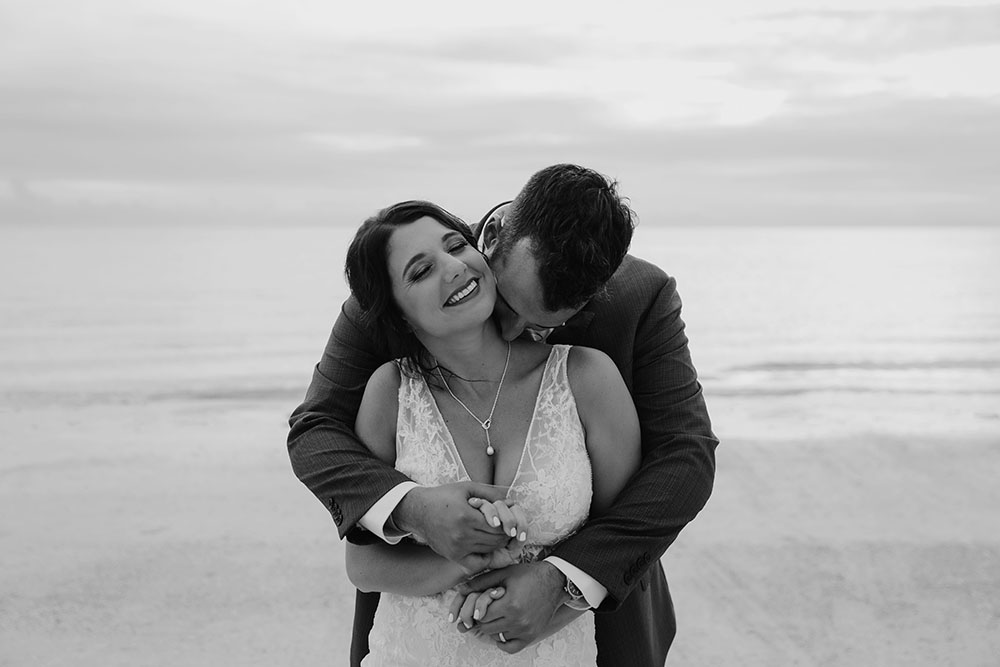 Naples Wedding Photographer, groom kissing bride's neck