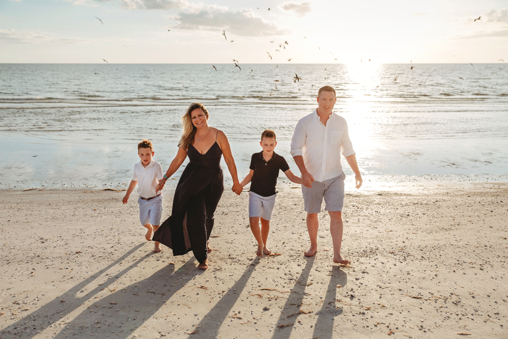 Naples Family Photographer, family walking on the beach
