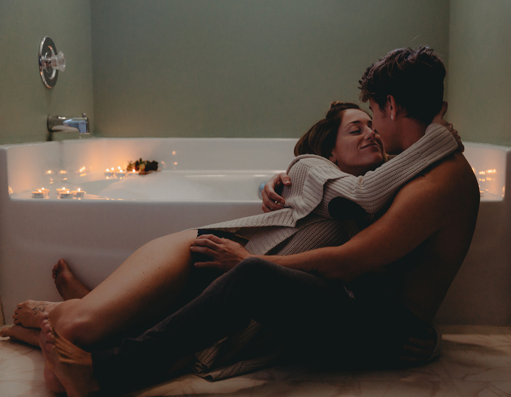 Naples Boudoir Photographer, couple sitting next to a bathtub
