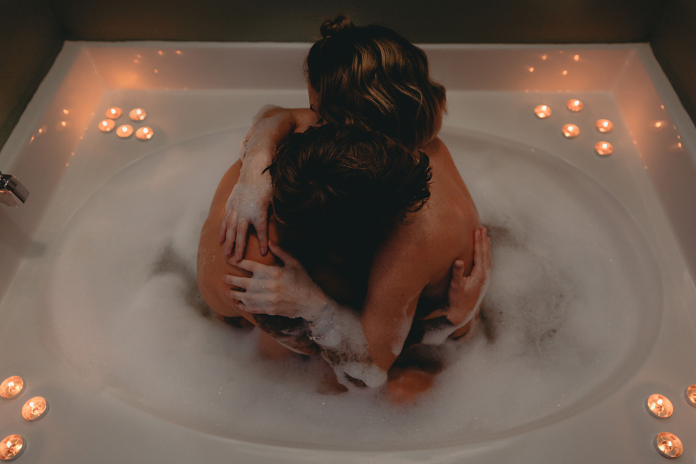 Naples Boudoir Photographer, couple hugging in a large bathtub