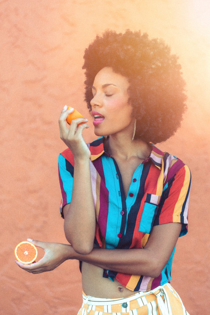 Naples Florida Branding Photographer, woman taking a bite of an orange