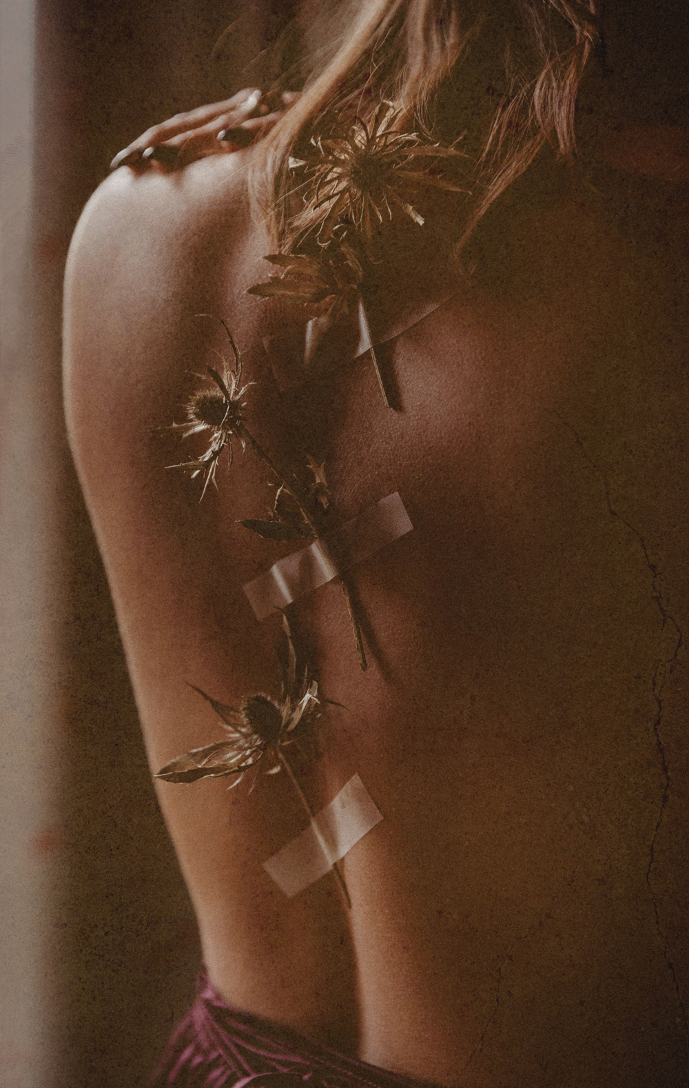 Naples Branding Photographer, wild flowers taped to woman's back