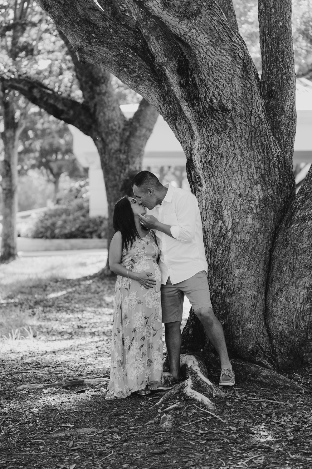 Naples Family Photographer, couple kissing under tree