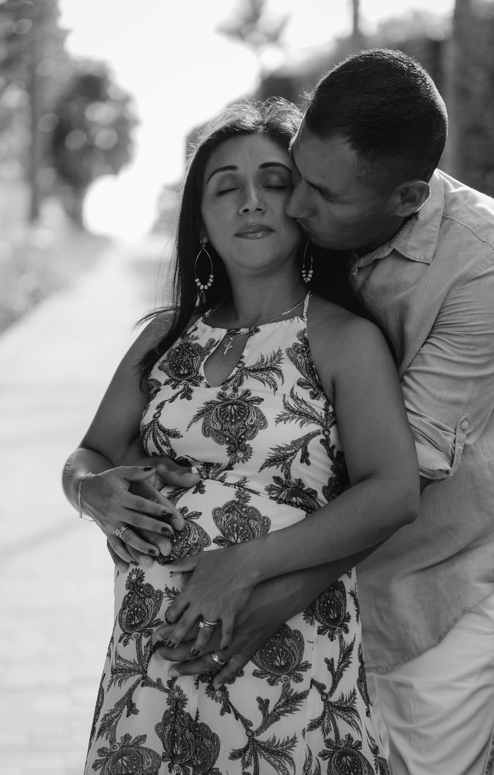 Naples Family Photographer, man holding pregnant woman's belly
