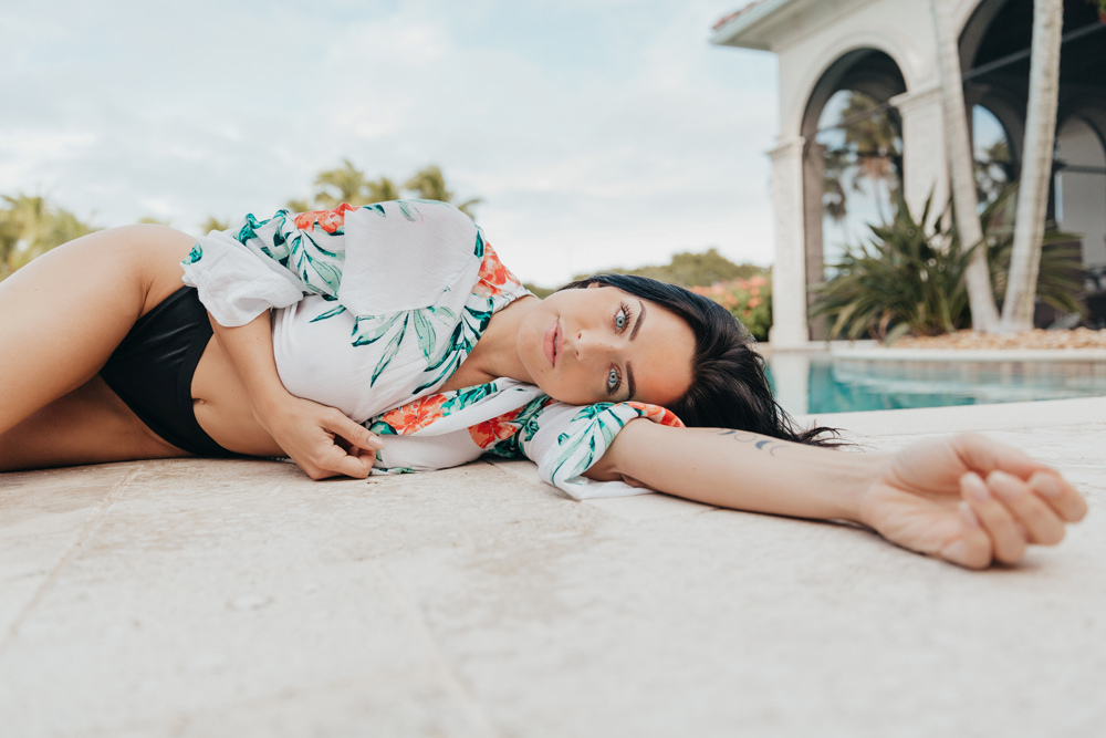 Naples Branding Photographer, woman laying next to pool