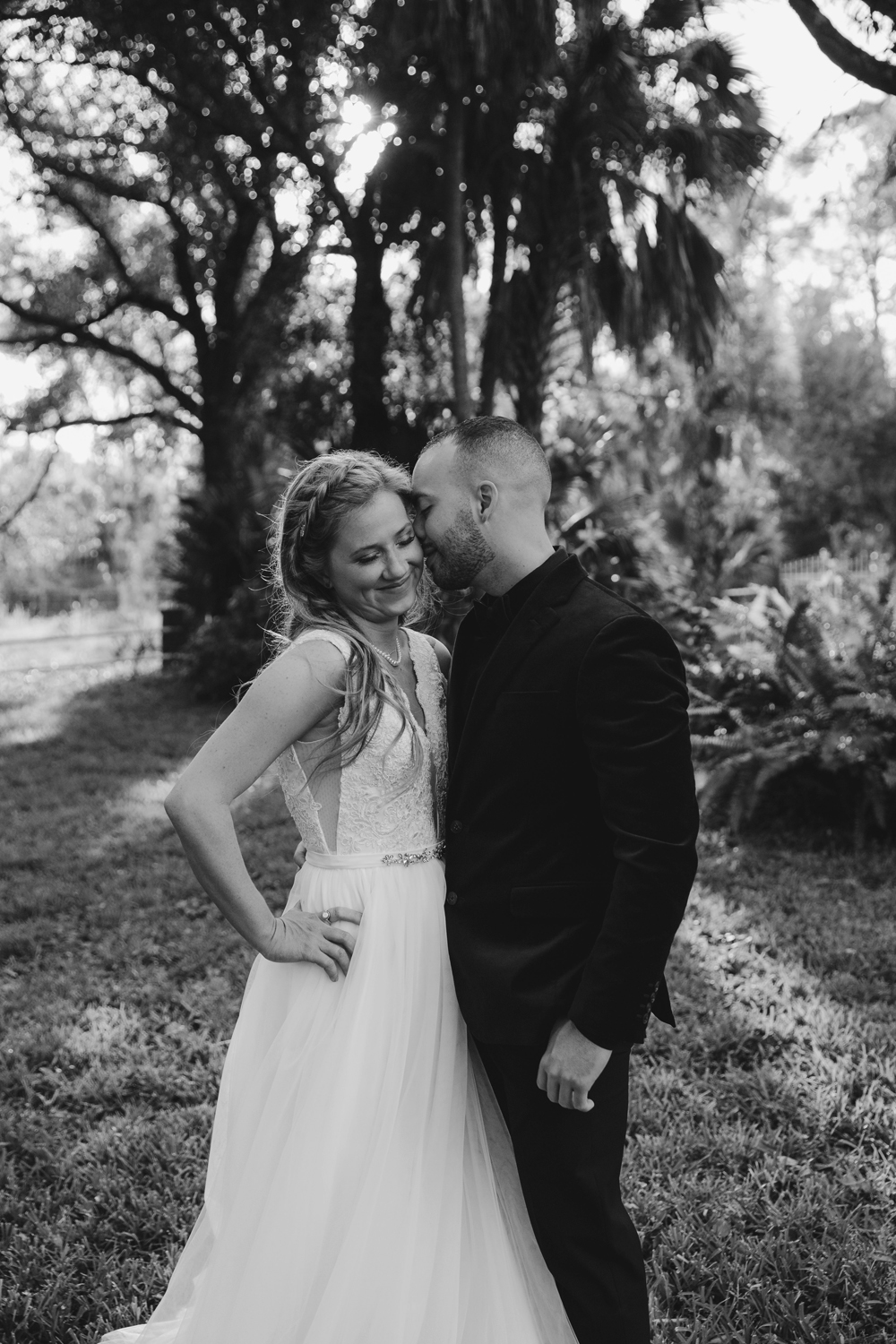 Naples Wedding Photographer, groom whispering into bride's ear