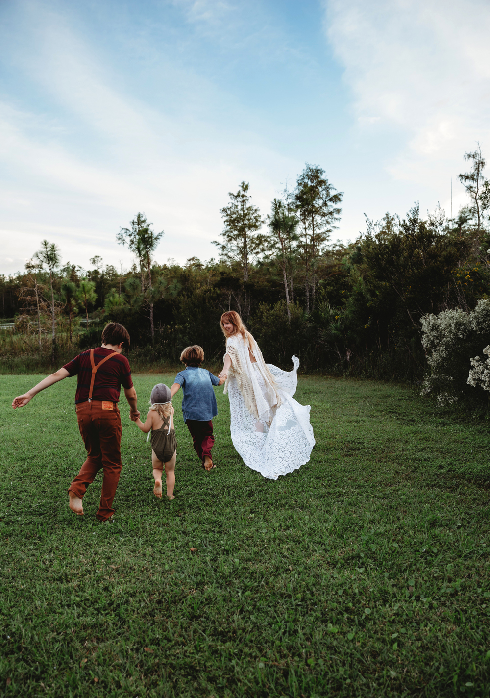 Naples Family Photographer, family running in the grass